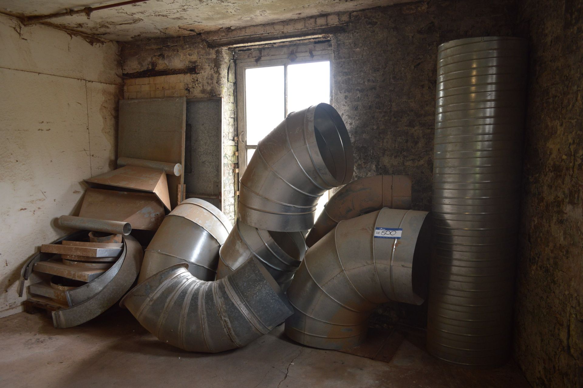 Galvanised Steel Ducting, as set out against wall