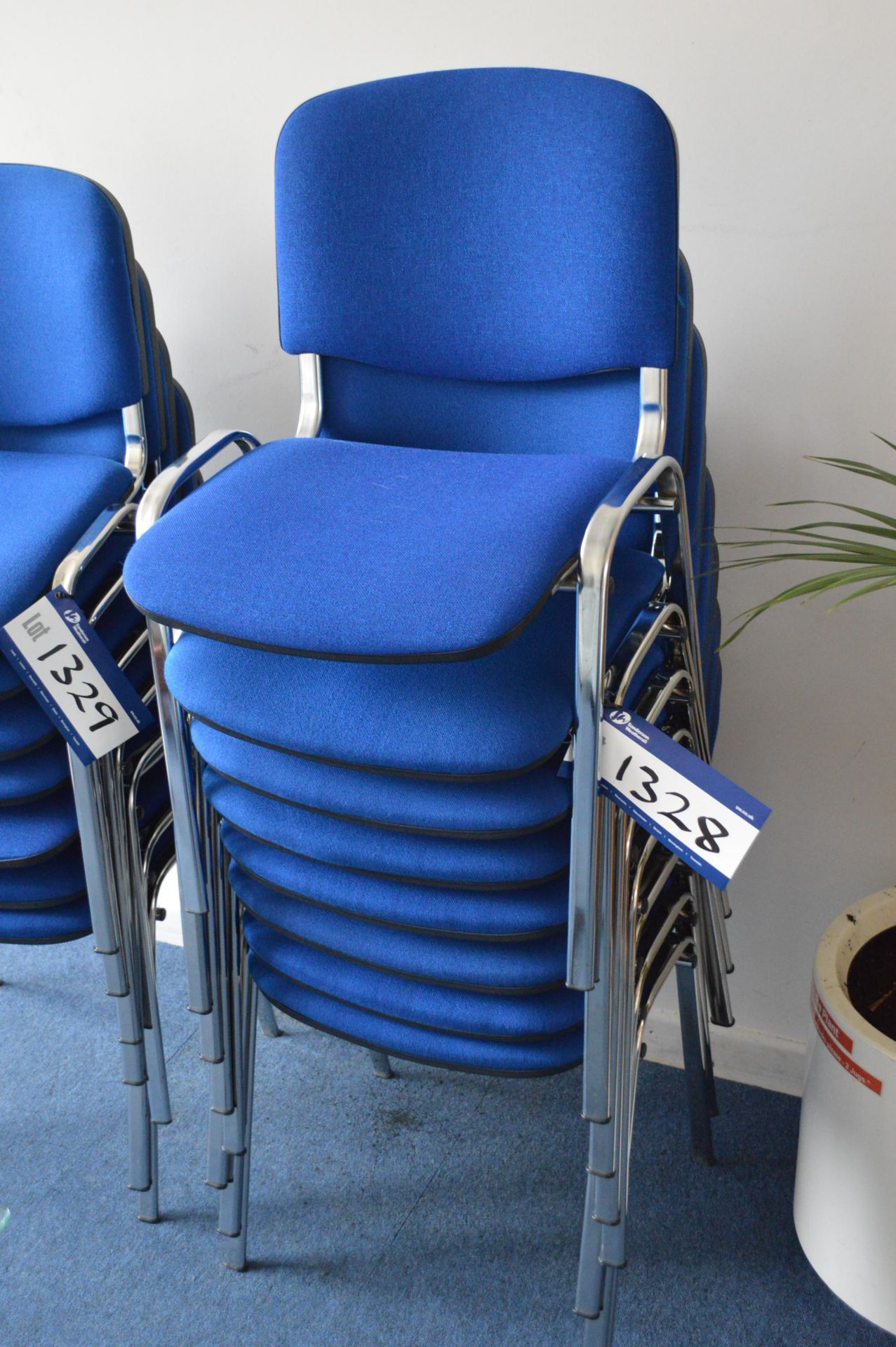 Eight Blue Cloth Upholstered Stacking Chairs