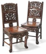 Paar "Drachen"-Stühle China, 19./ 20. Jh. Hartholz, teilweise aufwendig, teils durchbrochen