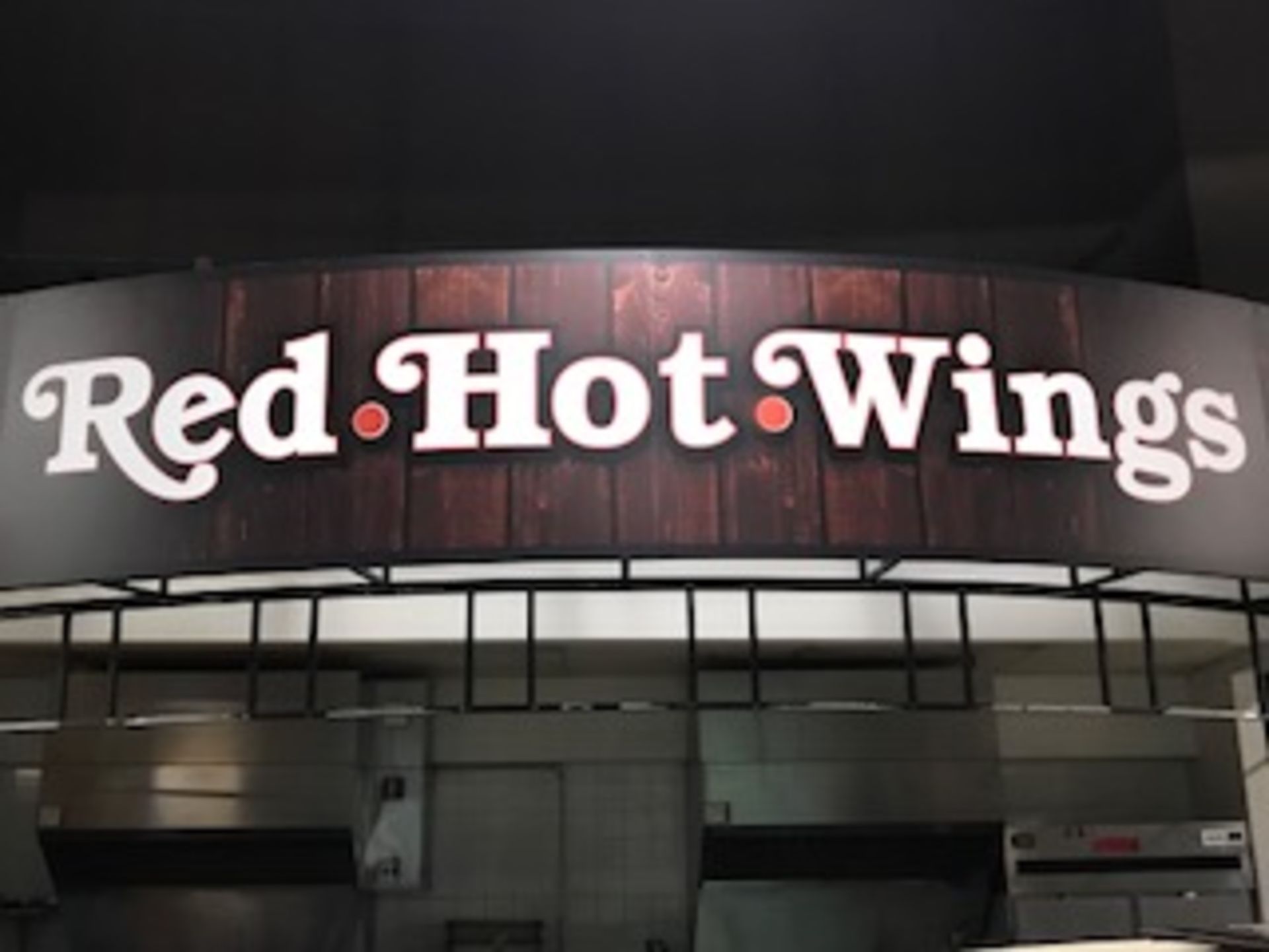 Sign - "Red Hot Wings" (2 Pcs.) 16 ft. w x 44 in. h ; Located in: Main Concourse ***Note from