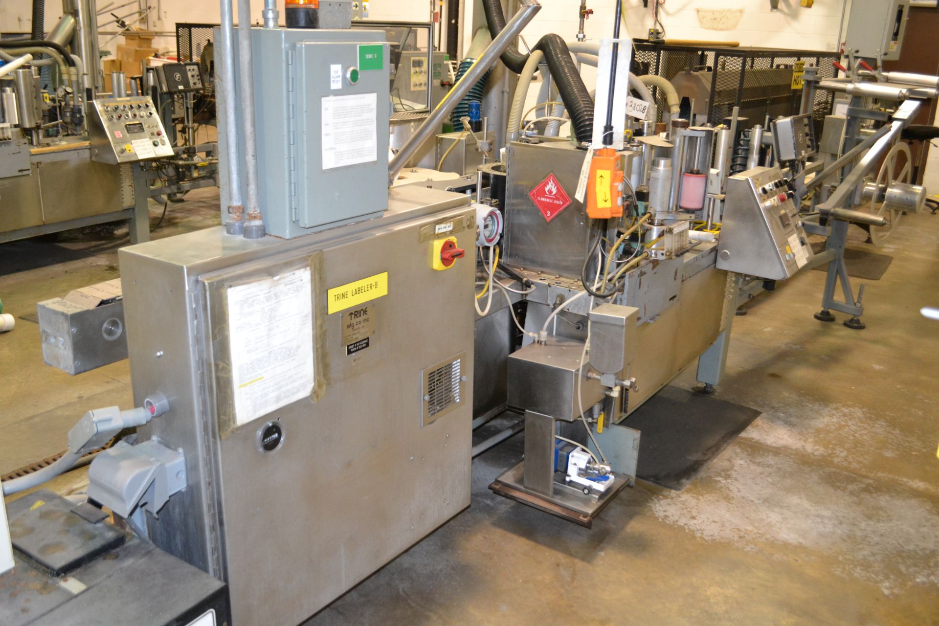 Trine model 5500G/S wraparound plastic film labeler, serial number 06955180, set up for a 211/