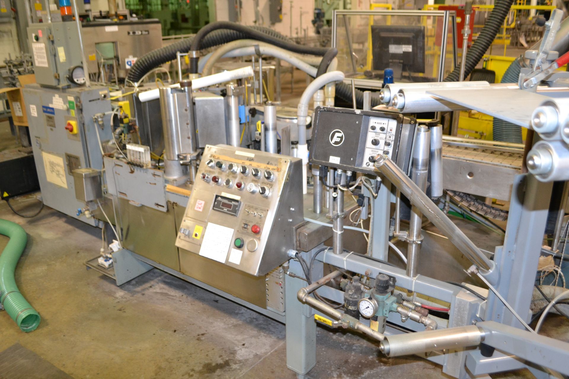 Trine model 5500G/S wraparound plastic film labeler, serial number 2-88-5500-125G/S, set up for a