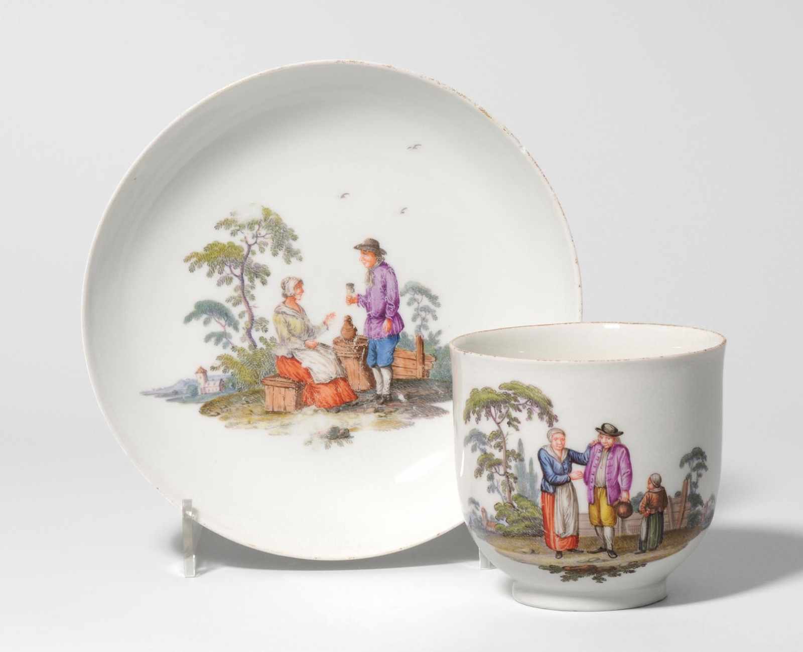 Tasse mit Untertasse, Meissen Um 1745. Porzellan, polychrom gemalte Bauernszenen. Bezeichnet: