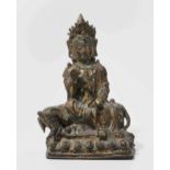 Figur China, wohl Ming-Dynastie. Bronze mit Resten einer Vergoldung. Auf Elefant sitzende Guanyin.