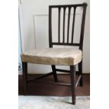 An Early 19th Century Mahogany Side Chair with serpentine front, stuff-over seat and on square