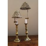 A Pair of 19th Century Brass Candlesticks with pierced clip-on shades (poss. Silver).