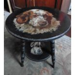 An Arts and Crafts Ebonised Occasional Table, the circular top painted with a St. Bernard, with a