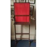 An Regency Rosewood Firescreen with rising centre pleated red panel, with brass inlaid string and