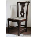 A Georgian Oak Side Chair with pierced vase back splat, drop in upholstered seat and shaped front