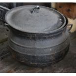 A Large Cast Iron Skillet Pot with lid, handles, and original hook.