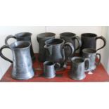 Nine Georgian Handled Pewter Tankards, some with marks and one with pouring spout.