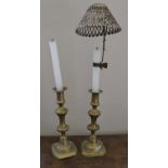 A Pair of 19th Century Brass Candlesticks with one pierced clip-on shade (poss. Silver).