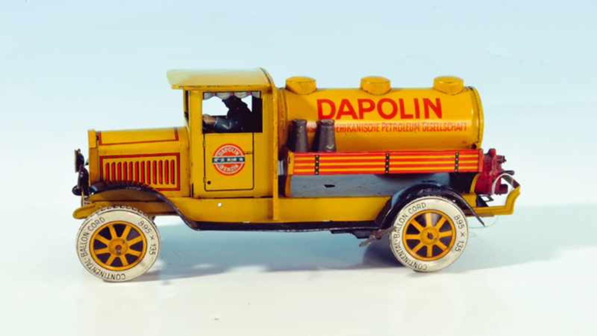 TippCo Tanklastwagen "DAPOLIN" 28 cm, gelb lithogr., Uhrwerkantrieb, mit Fahrerfigur und 2 orig.