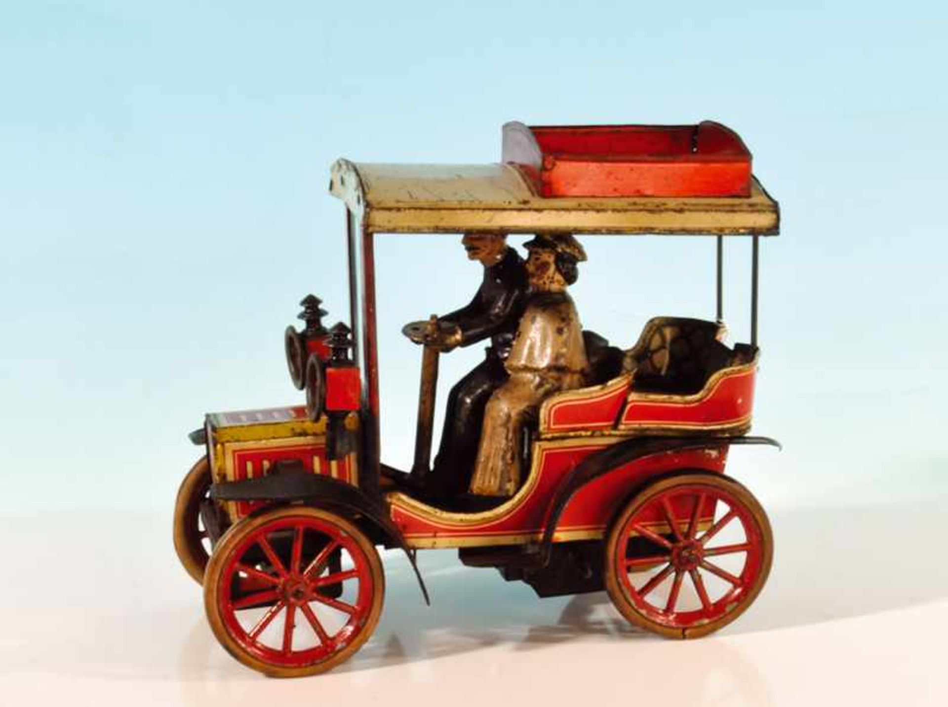 CARETTE Cabriolet No. 50 21 cm, rot/ceme lithogr., Uhrwerkantrieb, verstellbare Vorderachse, mit 2