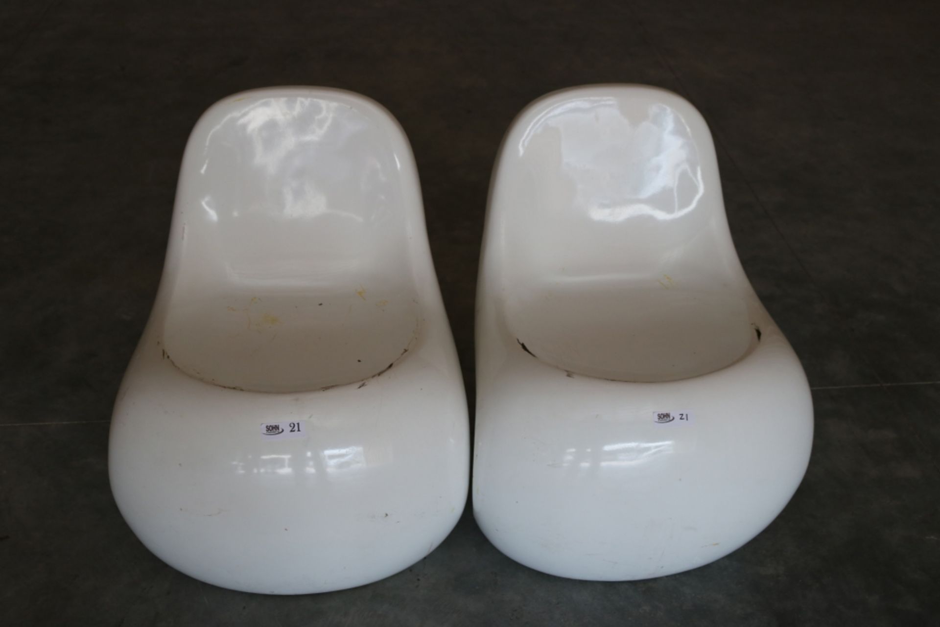 Two Small Hard Plastic Chairs