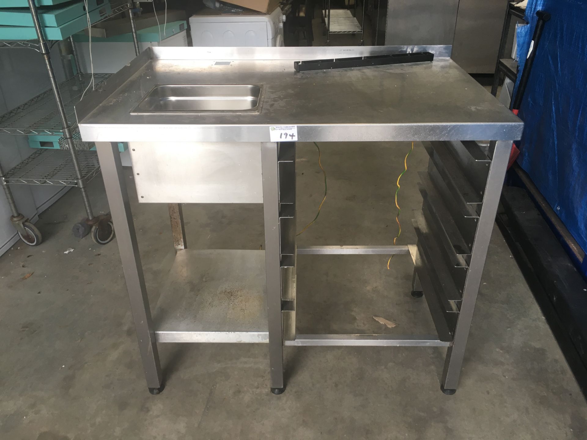 Stainless steel table with Racks undershelf and scrapping hole