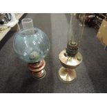 Two copper and brass oil lamps