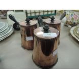 Three copper lidded pans