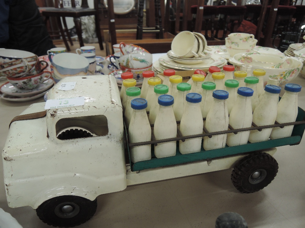 A Triang tin plate Milk Float with 28 plastic milk bottles