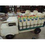 A Triang tin plate Milk Float with 28 plastic milk bottles