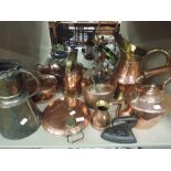 A collection of copper including pans, plate warmer and kettles