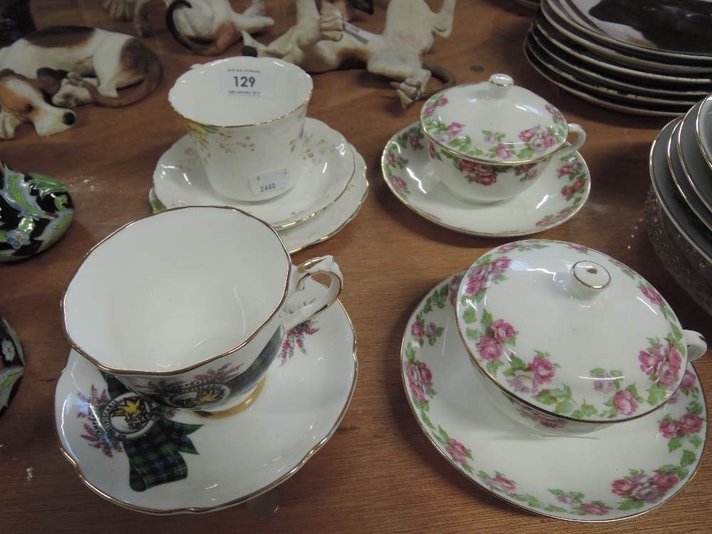 A Collingwood plate, cup and saucer, a Royal Grafton plate, cup and saucer and two lidded cups and