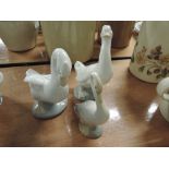 Two Nao geese figurines and another similar