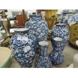 Five chintz floral blue and white vases