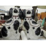 A pair of Staffordshire mantel dogs of traditional design