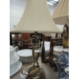 A brass effect side column table lamp and shade