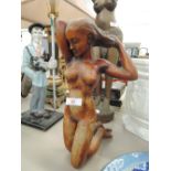 A resin figurine of a nude