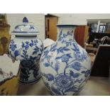 A blue and white Chinese style vase and lidded pot