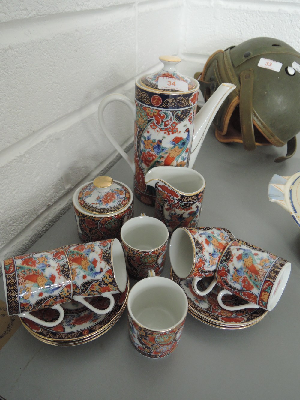 An Oriental style coffee set with peacock design