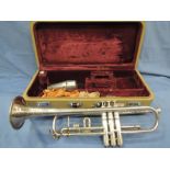 An early 20th Century Boosey and Hawkes trumpet, numbered 106174, in fitted case with accesories