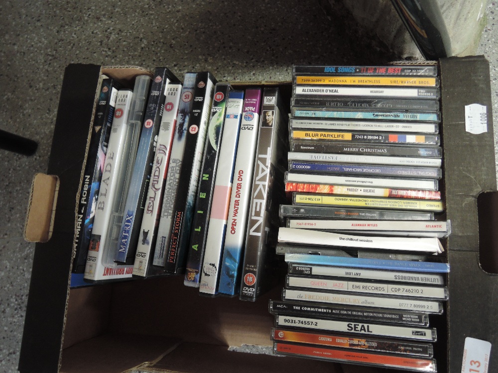 A box of various Cd's and DVD's