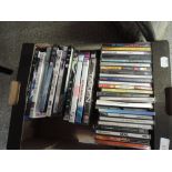 A box of various Cd's and DVD's