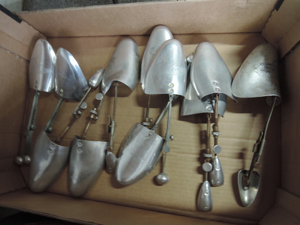 A collection of metal shoe shapers including Vic Tree Deluxe and W Barratt & Co Ltd, Northampton