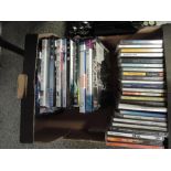 A box of various Cd's and DVD's