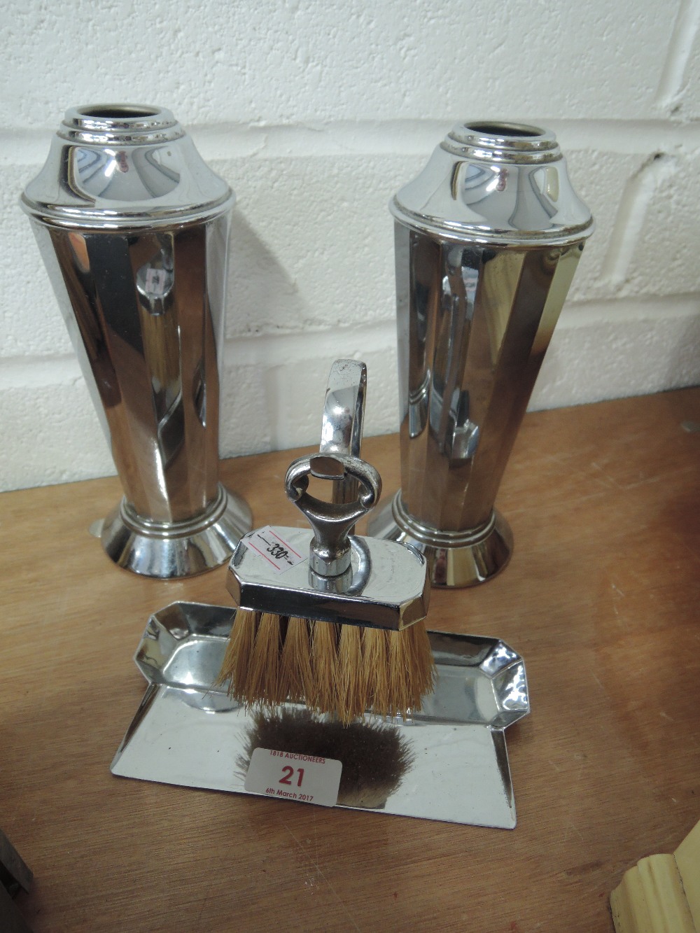 A pair of deco chrome vases and a brush and dustpan