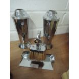 A pair of deco chrome vases and a brush and dustpan