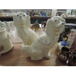 A pair of reproduction Staffordshire fireside dogs