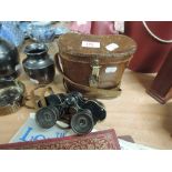 A pair of vintage binoculars, in leather case