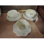 Three Belleek cups and saucers including shell design