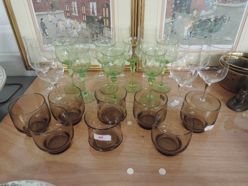 A selection of wine glasses and smoked glass tumblers