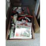 A collection of Manchester United football programmes, mainly 1990s