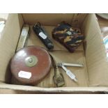 A vintage tape measure, pen knives and tortoiseshell style trinket box