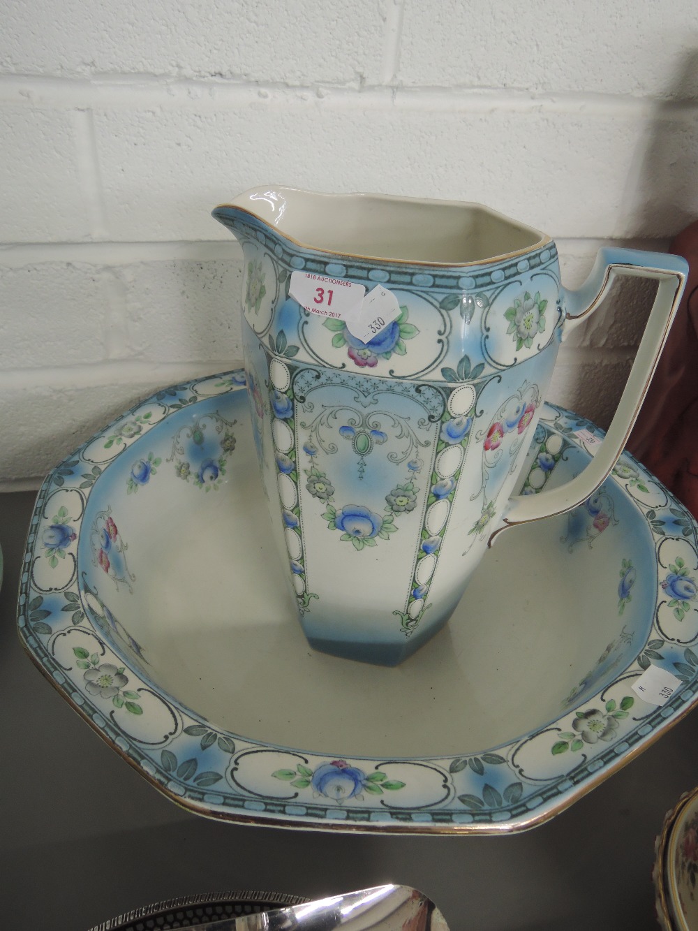 A wash bowl and jug stamped Tyne