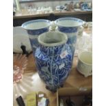 Three oriental blue and white vases