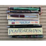 Four fountain pens and one ballpoint pen