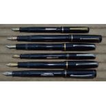 Five Burnham fountain pens, 2 with 14k gold nibs, and one Unique with damaged cap